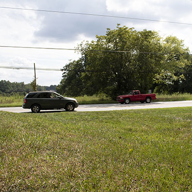 Red Pickup and Gray SUV Motion Arrested Image